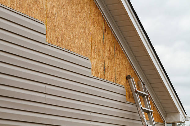 Professional Storm Damage Siding Repair technician working in Islip, NY